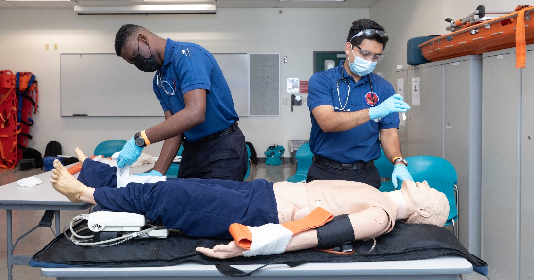 HCC EMS students provide care to a training dummy.