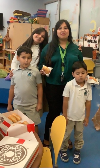 The Marron family - Isabella, Lucas, Celeste (mom) and Isais - pose for the photo.