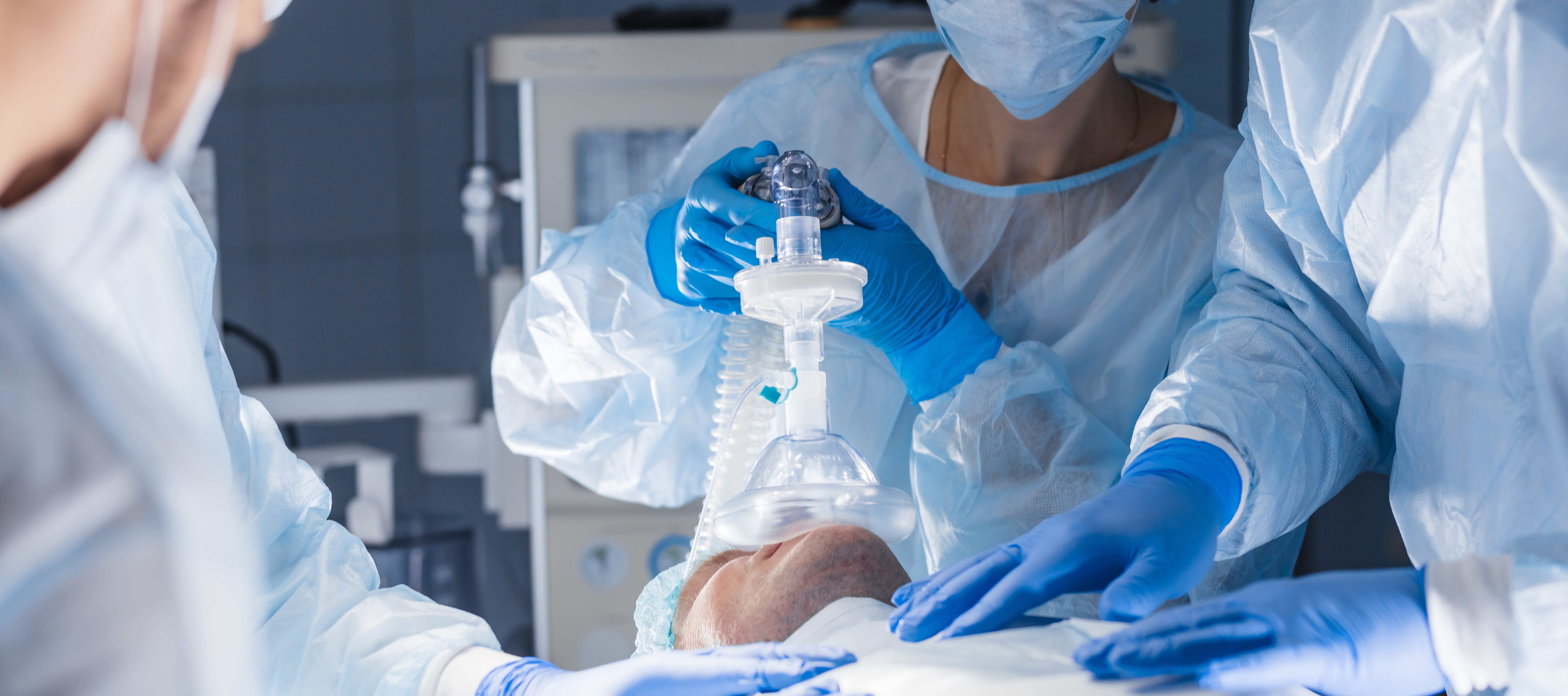 Anesthesist monitoring a patient during a medical procedure