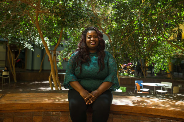 Female student sittiing on a bench