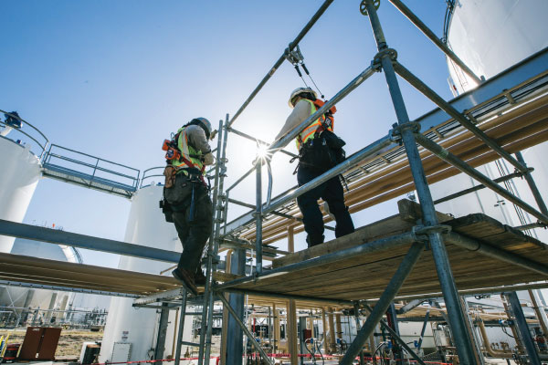 Workers inspecting some pipes