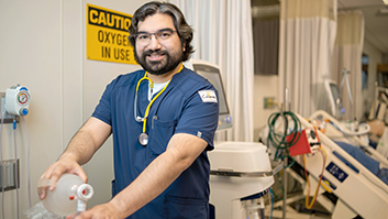 Respiratory Therapy student practicing on a medical training mannequin